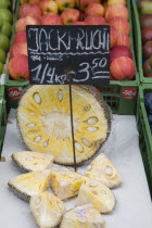 Austria, Vienna, The Naschmarkt, Jack Fruit for sale on fruit stall cut in half and into wedges.
