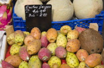 Austria, Vienna, The Naschmarkt, Melon, Prickly Pears and Coconut for sale in display on market fruit stall.