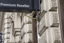 Austria, Vienna, Business sign on building facade reads Premium Reseller. 