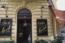 Austria, Vienna, Mariahilf District, Exterior facade of Cafe Sperl frequented by Adolf Hitler.  Striped awning pulled out at side with customers sitting at outside tables on street below.  