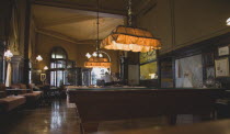 Austria, Vienna, Mariahilf District, Cafe Sperl, the preferred cafe of Adolf Hitler, interior with billiard table and customers sitting at bar and beside window. Established for over 120 years the Caf...