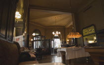 Austria, Vienna, Mariahilf District, Cafe Sperl, the preferred cafe of Adolf Hitler. Interior with partly seen customer reading newspaper in window seat. Established for over 120 years, the cafe offer...