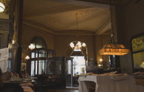 Austria, Vienna, Mariahilf District, Cafe Sperl, the preferred cafe of Adolf Hitler. Interior with customers reading.  Established for over 120 years, the cafe offers billiards and forbids mobile phon...