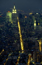 USA, New York, New York City, Manhattan, View over the city at night along 5th Avenue with the Empire State Building illuminated.