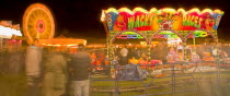 Entertainment, Funfairs, Rides, illuminated at night.
