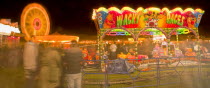 Entertainment, Funfairs, Rides, illuminated at night.