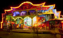 Entertainment, Funfairs, Rides, illuminated at night.