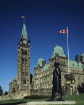 Canada, Ontario, Ottawa, Parliament building with green roof and flags flying.