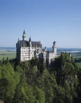 Germany, Bavaria, Fussen, Neuschwanstein Castle of King Ludwig on rocky hill.