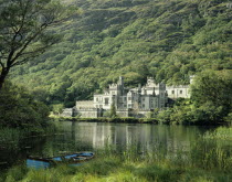 Ireland, County Galway, Connemara, Kylemore Abbey with lake in the foreground.