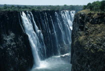 Zimbabwe, Victoria Falls, Zembezi river plunging into the gorge below, known as the smoke that thunders.