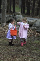 Festivals, Religious, Easter, Young Girls, Kylan Stone and Sarah Bleau, hunting for eggs, Keene, New Hampshire, USA.