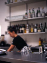 England, East Sussex, Brighton, Glass Coffee cups on bar in a cafe.