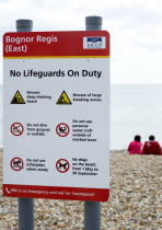 England, West Sussex, Bognor Regis, Sign on the beach warning that No Lifeguards ar On Duty and giving instruction on beach safety.