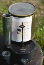 Climate, Weather, Measurements, Tipping Bucket Rain Gauge Recorder with ink pen marking duration of rainfall on graph paper attached to the drum at the Bognor Regis Weather Station.