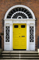 Ireland, County Dublin, Dublin City, Yellow Georgian door in the city centre south of the Liffey River.