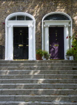 Ireland, County Dublin, Dublin City, Black and purple Georgian doors at the top of steps in the city centre south of the Liffey River.