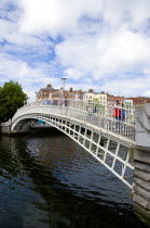 Ireland, County Dublin, Dublin City, The 1816 cast iron Ha Penny or Half Penny Bridge across the River Liffey.