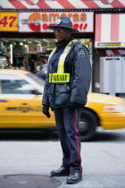USA, New York, Manhattan, Times Square Public Safety Officer in uniform on patrol in the major midtown tourist destination.