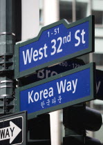 USA, New York, Manhattan, Street signs for West 32nd Street also known as Korea Way in Little Korea in Midtown.