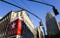 USA, New York, Manhattan, Macys department store with cars on 34th Street and Broadway with overhead traffic control lights. **Editorial Use Only**