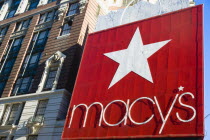 USA, New York, Manhattan, Red sign for Macys department store with cars on 34th Street and Broadway. **Editorial Use Only**