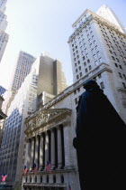 USA, New York, Manhattan, The New York Stock Exchange building in Broad Street beside Wall Street showing the main facade of the building featuring marble sculpture by John Quincy Adams Ward in the pe...