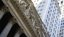 USA, New York, Manhattan, The New York Stock Exchange building in Broad Street beside Wall Street showing the main facade of the building featuring marble sculpture by John Quincy Adams Ward in the pe...