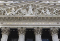 USA, New York, Manhattan, The New York Stock Exchange building in Broad Street beside Wall Street showing the main facade of the building featuring marble sculpture by John Quincy Adams Ward in the pe...