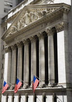 USA, New York, Manhattan, The New York Stock Exchange building in Broad Street beside Wall Street showing the main facade of the building featuring marble sculpture by John Quincy Adams Ward in the pe...