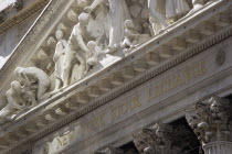 USA, New York, Manhattan, The New York Stock Exchange building in Broad Street beside Wall Street showing the main facade of the building featuring marble sculpture by John Quincy Adams Ward in the pe...