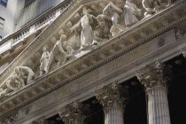 USA, New York, Manhattan, The New York Stock Exchange building in Broad Street beside Wall Street showing the main facade of the building featuring marble sculpture by John Quincy Adams Ward in the pe...