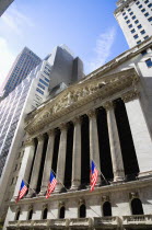 USA, New York, Manhattan, The New York Stock Exchange building in Broad Street beside Wall Street showing the main facade of the building featuring marble sculpture by John Quincy Adams Ward in the pe...