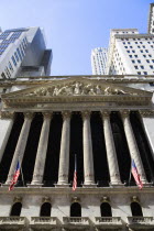 The New York Stock Exchange building in Broad Street beside Wall Street showing the main facade of the building featuring marble sculpture by John Quincy Adams Ward in the pediment called Integrity Pr...