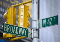 USA, New York, Manhattan, Roadsigns for Broadway at West 42nd Street in the theatre district with traffic lights.