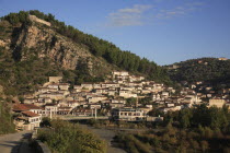 Albania, Berat, Traditional Ottoman buildings and footbridge over the river Osum.