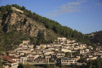 Albania, Berat, Traditional Ottoman buildings and footbridge over the river Osum.