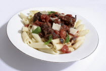Food, Cooked, Pasta, Italian baked meat balls with black olives, basil and parmesan cheese served on penne.