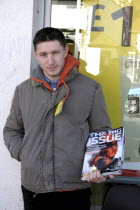 Social Issues, Homelessness, A youth selling the Big Issue in Thame in the UK.
