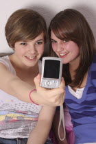 Children, Teens, Female, Two teenage girls taking a photo of themselves.