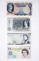 Banking, Finance, Money, Four different English five pound notes spanning sixty years.