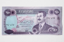 Iraq, Currency, An Iraqi bank note with Saddam Hussein on it.