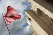 Albania, Kruja, National flag depicting black double headed eagle against red background flying at the entrance to Kruja Castle and Skanderbeg Museum.