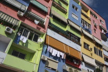 Albania, Tirane, Tirana, Angled part view of exterior facade of multi coloured apartment block.