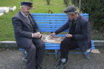 Albania, Berat, Old men playing dominos.