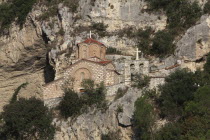 Albania, Berat, Church of St Michael under rock face.