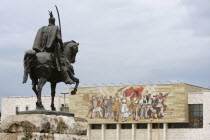 Albania, Tirane, Tirana, Statue of Skanderbeg in Skanderbeg Square with the  National History Museum in the background.