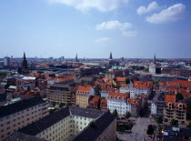 Denmark, Copenhagen, View northwest over city rooftops from the tower of the Church of Our Saviour, with spire of the Royal Palace Christiansborgslott centre right.