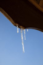 Weather, Winter, Frost, Icicles hanging from household facia panel.