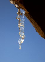 Weather, Winter, Frost, Icicle hanging from household facia panel.